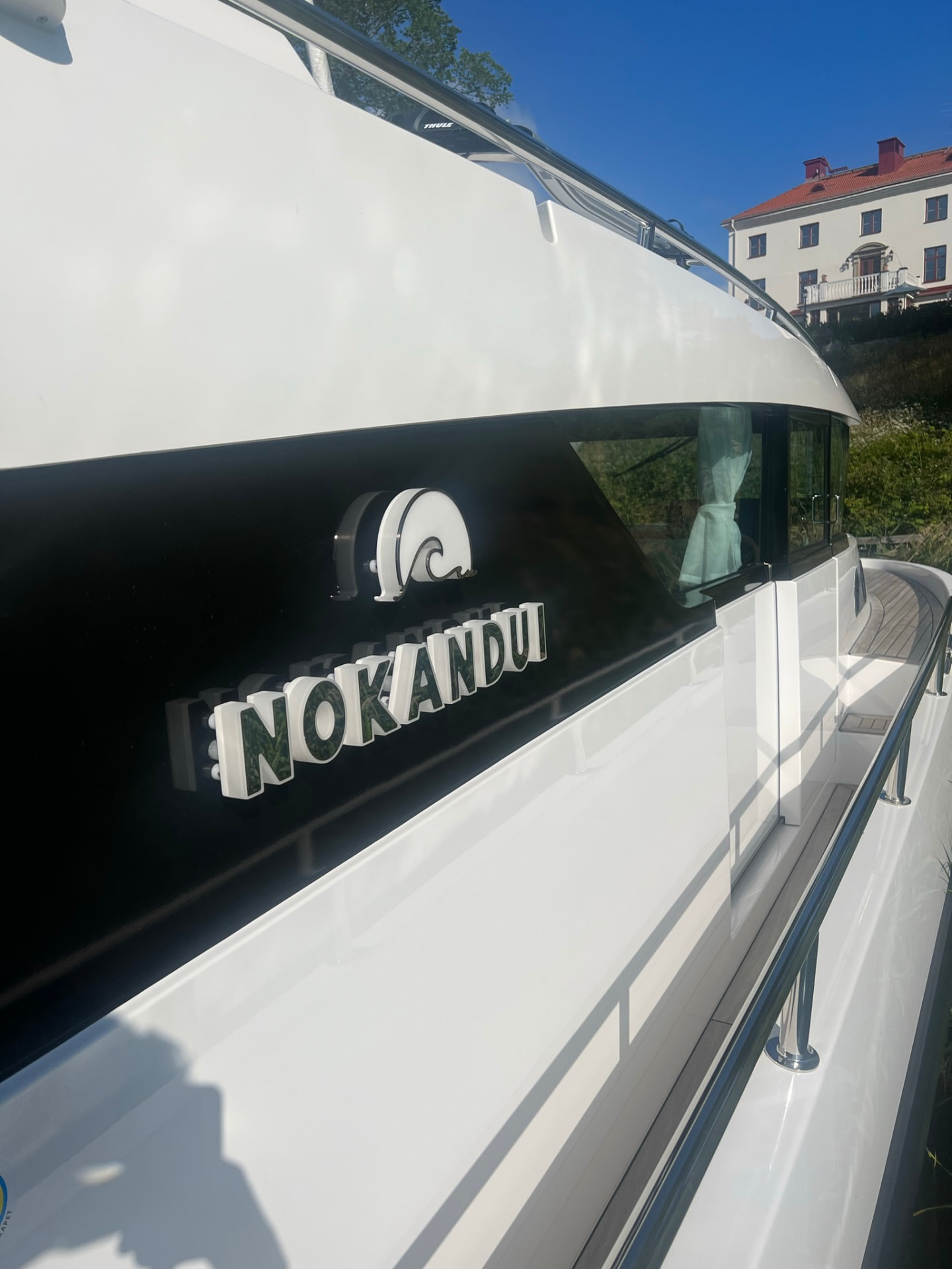 NOKANDUI illuminated nameboard on a yacht superstructure